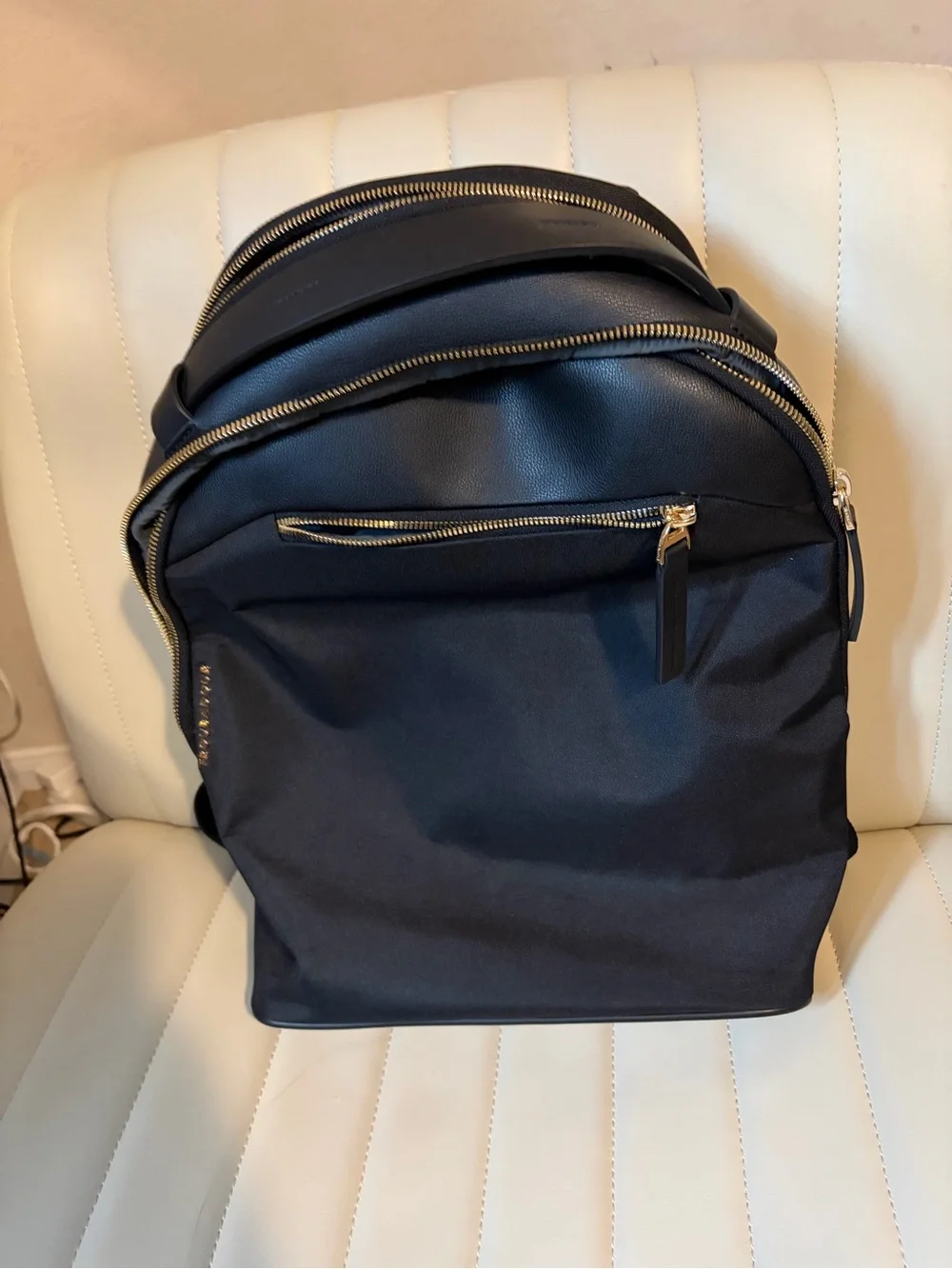 Sophisticated Black Women's Backpack with Gold Hardware